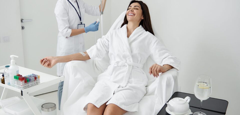 Full,Length,Portrait,Of,Attractive,Woman,In,White,Bathrobe,Lying